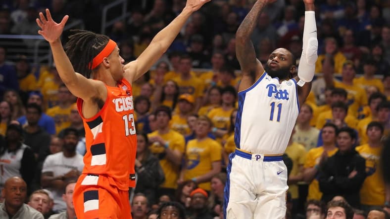 Pittsburgh Panthers guard Jamarius Burton (11) attempts a three point shot after gaining space from Syracuse Orange forward Benny Williams (13) during the first half on February 25, 2023 at the Petersen Events Center in Pittsburgh, PA.
Pittsburgh Panthers Vs Syracuse Orange Mens Basketball