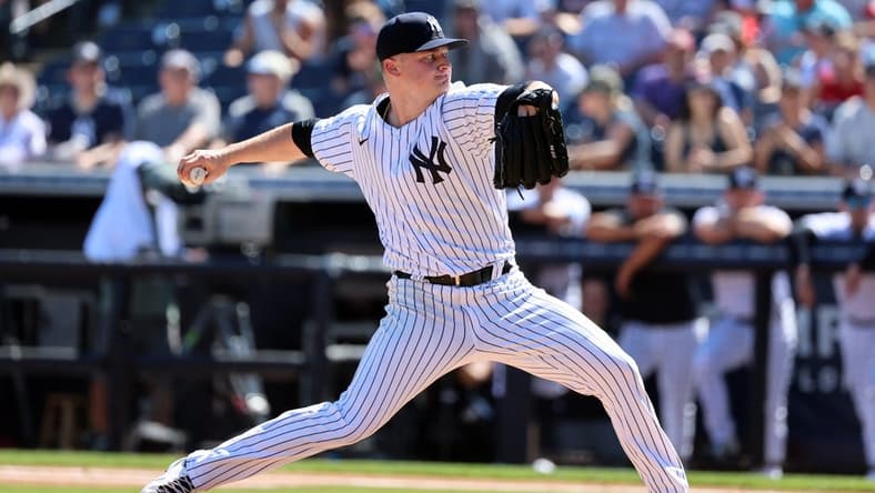 Feb 26, 2023; Tampa, Florida, USA; New York Yankees starting pitcher Clarke Schmidt (86) throws a pitch during the first inning against the Atlanta Braves at George M. Steinbrenner Field. Mandatory Credit: Kim Klement-USA TODAY Sports