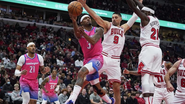 Feb 26, 2023; Chicago, Illinois, USA; Chicago Bulls guard Patrick Beverly (21) and center Nikola Vucevic (9) defend Washington Wizards guard Bradley Beal (3) during the first half at United Center. Mandatory Credit: David Banks-USA TODAY Sports