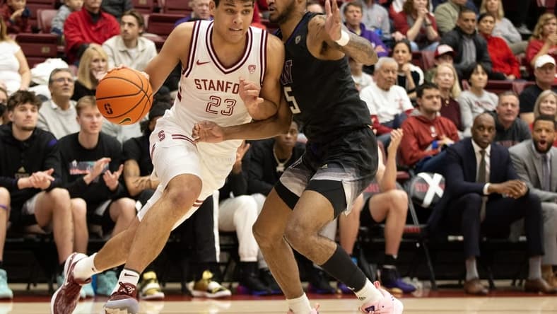 Feb 26, 2023; Stanford, California, USA; Stanford Cardinal forward Brandon Angel (23) drives the baseline past Washington Huskies guard Jamal Bey (5) during the first half at Maples Pavilion. Mandatory Credit: D. Ross Cameron-USA TODAY Sports