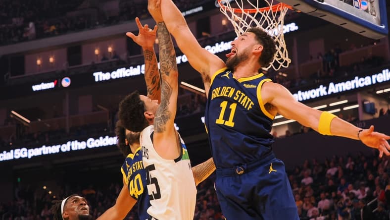 Feb 26, 2023; San Francisco, California, USA; Golden State Warriors guard Klay Thompson (11) defends the shot by Minnesota Timberwolves guard Austin Rivers (25) during the first quarter at Chase Center. Mandatory Credit: Kelley L Cox-USA TODAY Sports