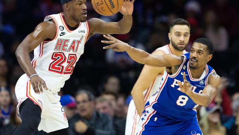 Feb 27, 2023; Philadelphia, Pennsylvania, USA; Philadelphia 76ers guard De'Anthony Melton (8) passes the ball past Miami Heat forward Jimmy Butler (22) during the first quarter at Wells Fargo Center. Mandatory Credit: Bill Streicher-USA TODAY Sports