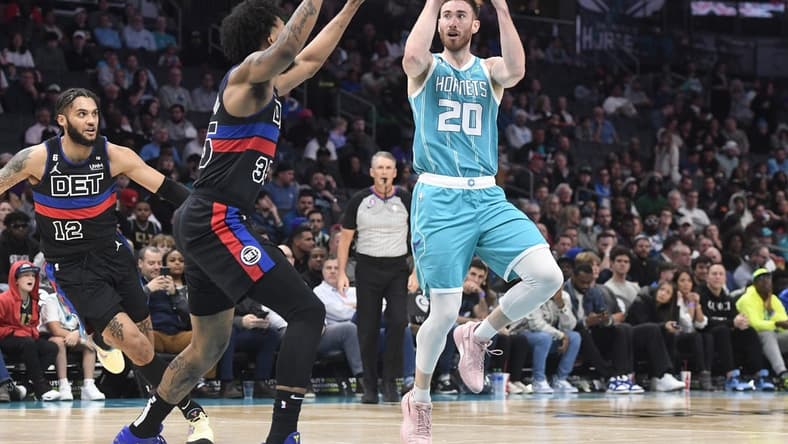 Feb 27, 2023; Charlotte, North Carolina, USA; Charlotte Hornets forward Gordon Hayward (20) shoots as he is defended by Detroit Pistons forward Marvin Bagley III (35) during the first half at the Spectrum Center. Mandatory Credit: Sam Sharpe-USA TODAY Sports