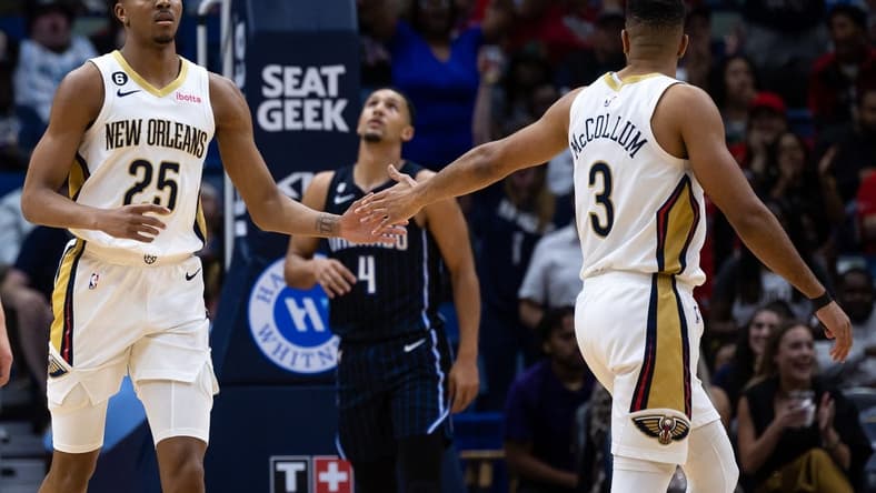 Feb 27, 2023; New Orleans, Louisiana, USA; New Orleans Pelicans guard Trey Murphy III (25) reacts to making a three point basket with guard CJ McCollum (3) against the Orlando Magic during the first half at Smoothie King Center. Mandatory Credit: Stephen Lew-USA TODAY Sports
