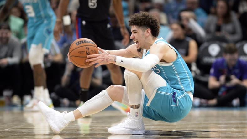 Feb 27, 2023; Charlotte, North Carolina, USA; Charlotte Hornets guard LaMelo Ball (1) controls the ball as he falls down during play during the second half against the Detroit Pistons at the Spectrum Center. Mandatory Credit: Sam Sharpe-USA TODAY Sports