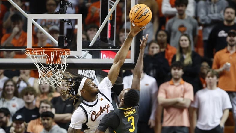 Feb 27, 2023; Stillwater, Oklahoma, USA; Oklahoma State Cowboys forward Tyreek Smith (23) blocks a shot by Baylor Bears guard Dale Bonner (3) during the first half at Gallagher-Iba Arena. Mandatory Credit: Alonzo Adams-USA TODAY Sports