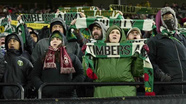 Feb 27, 2023; Portland, Oregon, USA; Portland Timbers fans sing a song during the second half during a game against Sporting Kansas City at Providence Park. Mandatory Credit: Troy Wayrynen-USA TODAY Sports