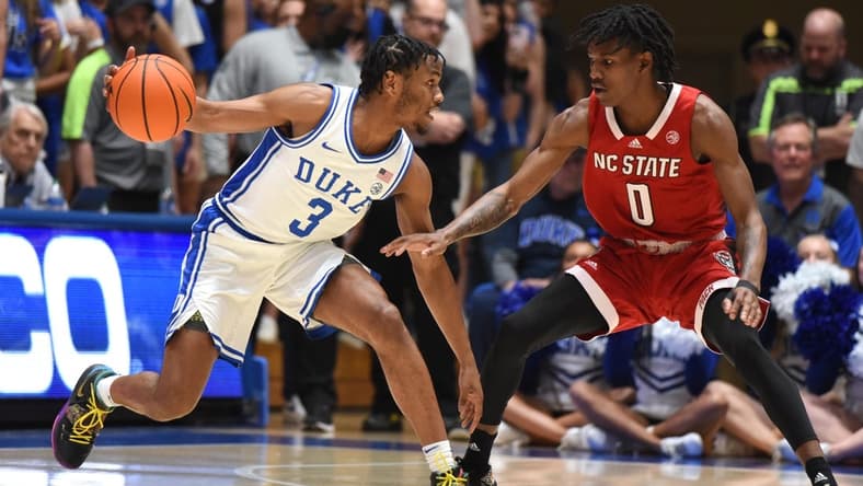 Feb 28, 2023; Durham, North Carolina, USA; Duke Blue Devils guard Jeremy Roach (3) controls the ball in front of North Carolina State Wolfpack guard Terquavion Smith (0) during the first half at Cameron Indoor Stadium. Mandatory Credit: Rob Kinnan-USA TODAY Sports