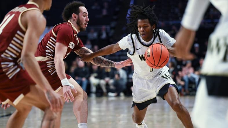 Feb 28, 2023; Winston-Salem, North Carolina, USA; Wake Forest Demon Deacons guard Tyree Appleby (1) drives past Boston College Eagles guard Jaeden Zackery (3) during the first half at Lawrence Joel Veterans Memorial Coliseum. Mandatory Credit: William Howard-USA TODAY Sports