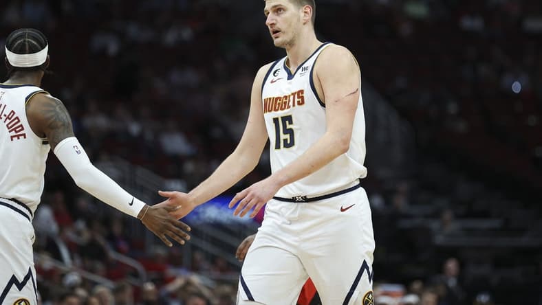 Feb 28, 2023; Houston, Texas, USA; Denver Nuggets center Nikola Jokic (15) reacts after a play during the first quarter against the Houston Rockets at Toyota Center. Mandatory Credit: Troy Taormina-USA TODAY Sports