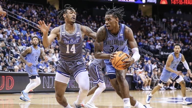 Feb 28, 2023; Newark, New Jersey, USA; Villanova Wildcats forward Brandon Slater (34) looks to drive past Seton Hall Pirates guard Dre Davis (14) in the first half at Prudential Center. Mandatory Credit: Wendell Cruz-USA TODAY Sports