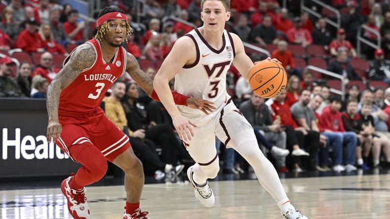 Feb 28, 2023; Louisville, Kentucky, USA; Virginia Tech Hokies guard Sean Pedulla (3) dribbles against Louisville Cardinals guard El Ellis (3) during the first half at KFC Yum! Center. Mandatory Credit: Jamie Rhodes-USA TODAY Sports