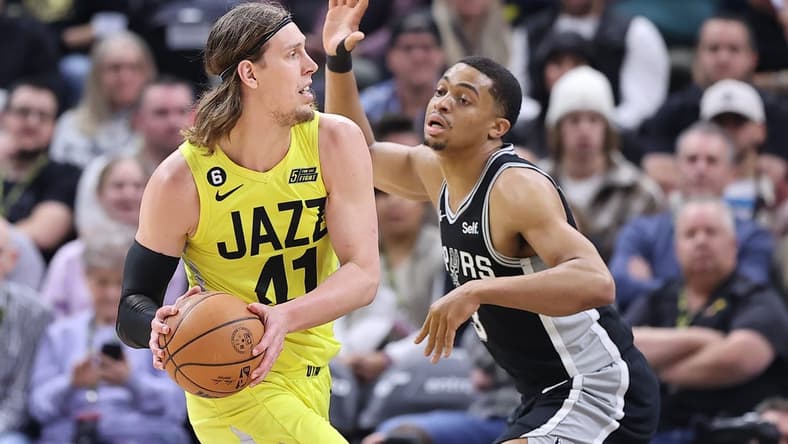 Feb 28, 2023; Salt Lake City, Utah, USA; Utah Jazz forward Kelly Olynyk (41) passes against San Antonio Spurs forward Keldon Johnson (3) in the second quarter at Vivint Arena. Mandatory Credit: Rob Gray-USA TODAY Sports