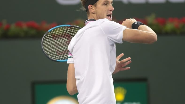 Nicolas Jarry returns a shot to Frances Tiafoe at the BNP Paribas Open, Indian Wells, Calif., March 8, 2019.
Tiafoe 7