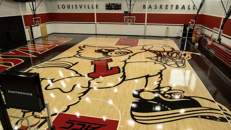 The new image of the cardinal mascot dunking has been completed on the floor of the U of L basketball practice facility on Floyd Street. May 15, 2019

T9i1136 Uofl Logo