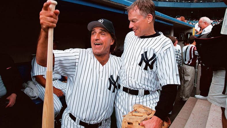 From left, former New York Yankees Joe Pepitone and Jim Bouton share some laughs before action in the Old-Timers' Game against the Los Angeles Dodgers at Yankee Stadium on July 25, 1998.

24019207 00006