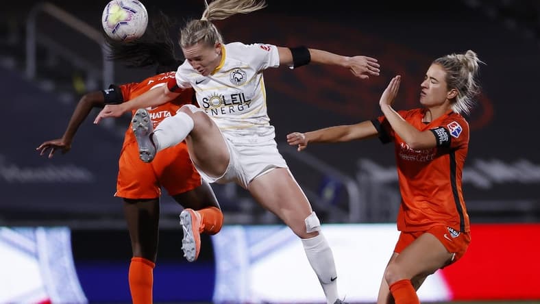 Jul 17, 2020; Herriman, Utah, USA; Houston Dash forward Nichelle Prince (8) and Utah Royals FC forward Amy Rodriguez (8) battle for the ball in the second half at Zions Bank Stadium. Mandatory Credit: Jeffrey Swinger-USA TODAY Sports