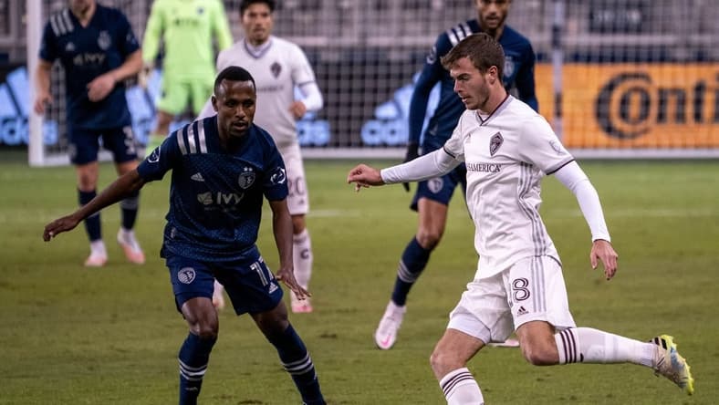 Oct 24, 2020; Kansas City, Kansas, USA; Colorado Rapids defender Jeremy Kelly (18) moves the ball as Sporting Kansas City midfielder Gadi Kinda (17) defends during the match at Children's Mercy Park. Mandatory Credit: Denny Medley-USA TODAY Sports