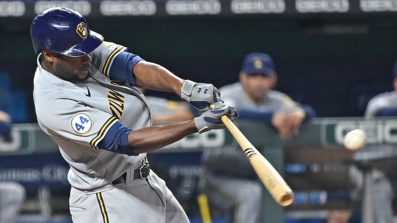 May 18, 2021; Kansas City, Missouri, USA; Milwaukee Brewers center fielder Lorenzo Cain (6) singles during the ninth inning against the Kansas City Royals at Kauffman Stadium. Mandatory Credit: Peter Aiken-USA TODAY Sports
