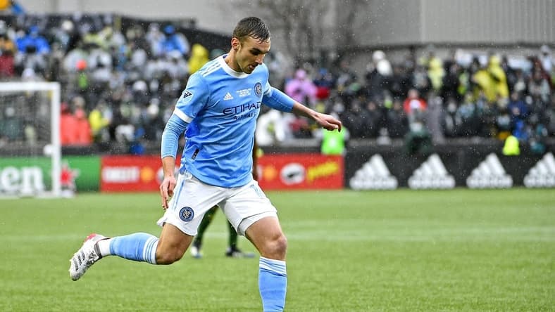 Dec 11, 2021; Portland, OR, USA; New York City FC midfielder James Sands (16) kicks the ball during the first half against the Portland Timbers in the 2021 MLS Cup championship game at Providence Park. Mandatory Credit: Troy Wayrynen-USA TODAY Sports