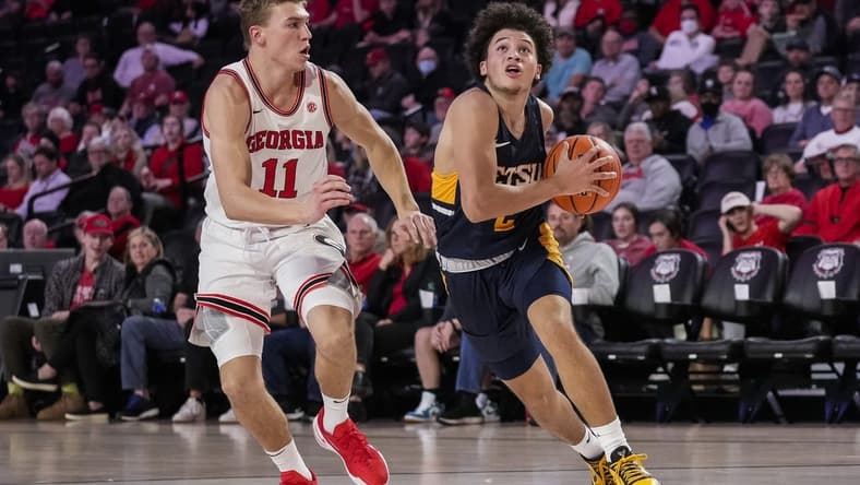 Dec 22, 2021; Athens, Georgia, USA; East Tennessee State Buccaneers guard Jordan King (2) drives to the basket against Georgia Bulldogs forward Jaxon Etter (11) during the first half at Stegeman Coliseum. Mandatory Credit: Dale Zanine-USA TODAY Sports