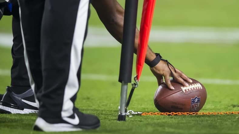 Oct 28, 2021; Glendale, Arizona, USA; Detailed view as referee measures the football for a first down with yard markers during the Arizona Cardinals game against the Green Bay Packers at State Farm Stadium. Mandatory Credit: Mark J. Rebilas-USA TODAY Sports