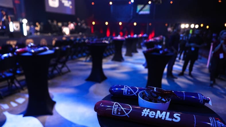 Thunder sticks are placed on chairs and tables for fans. The eMLS Cup tournament was held in-person at the Moody Theater on March 13, 2022. The eMLS Cup is the championship tournament that determines which player is the best FIFA player in North America.
Aem Sxsw Emls Cup 2