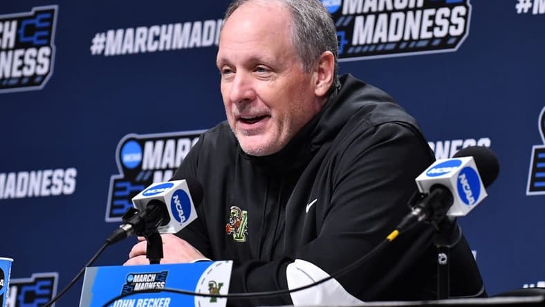 Mar 16, 2022; Buffalo, NY, USA; Vermont Catamounts head coach John Becker talks with the press before a practice session for the first round of the 2022 NCAA Tournament at KeyBank Center. Mandatory Credit: Mark Konezny-USA TODAY Sports