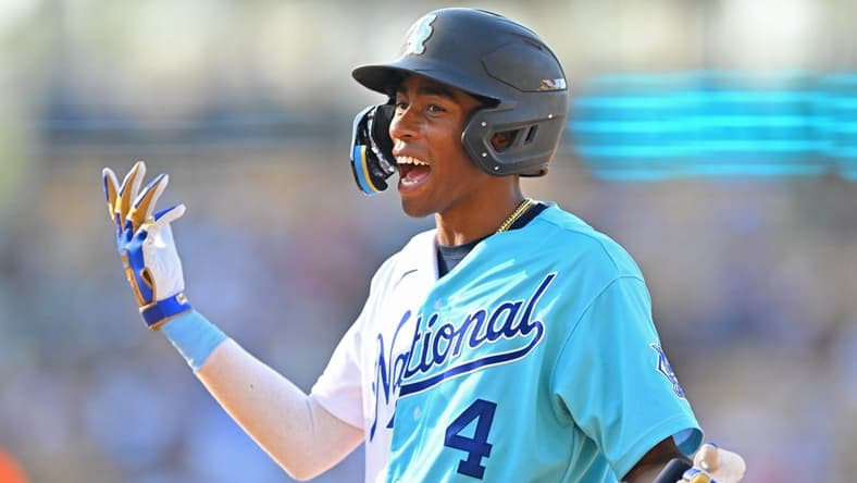 Jul 16, 2022; Los Angeles, CA, USA; National League Futures infielder Darren Baker (4) reacts after American League Futures relief pitcher Yosver Zulueta (not pictured) makes a diving catch on batted ball by Baker for out in the sixth inning of the All Star-Futures Game at Dodger Stadium. Mandatory Credit: Jayne Kamin-Oncea-USA TODAY Sports