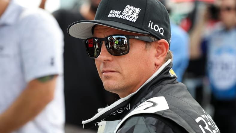 Aug 20, 2022; Watkins Glen, New York, USA; NASCAR Cup Series driver Kimi Raikkonen sits on the pit wall during practice and qualifying for the Go Bowling at The Glen at Watkins Glen International. Mandatory Credit: Matthew OHaren-USA TODAY Sports