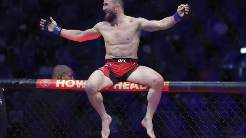 Aug 20, 2022; Salt Lake City, Utah, USA; Merab Dvalishvili (blue gloves) reacts after defeating Jose Aldo (red gloves) during UFC 278 at Vivint Arena. Mandatory Credit: Jeffrey Swinger-USA TODAY Sports