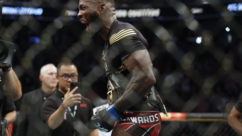 Aug 20, 2022; Salt Lake City, Utah, USA; Leon Edwards (blue gloves) reacts after defeating Kamaru Usman (red gloves) during UFC 278 at Vivint Arena. Mandatory Credit: Jeffrey Swinger-USA TODAY Sports