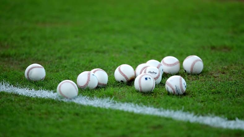 Sep 5, 2022; Houston, Texas, USA; A set of baseballs rest on the infield grass prior to the game between the Houston Astros and the Texas Rangers at Minute Maid Park. Mandatory Credit: Erik Williams-USA TODAY Sports