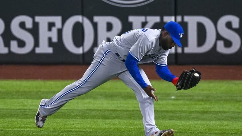 Sep 9, 2022; Arlington, Texas, USA; Toronto Blue Jays right fielder Jackie Bradley Jr. (25) catches a line drive hit by Texas Rangers designated hitter Kole Calhoun (not pictured) during the seventh inning at Globe Life Field. Mandatory Credit: Jerome Miron-USA TODAY Sports