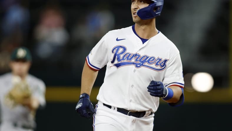 Sep 13, 2022; Arlington, Texas, USA; Texas Rangers first baseman Mark Mathias (9) rounds the bases after hitting a two run home run in the seventh inning against the Oakland Athletics at Globe Life Field. Mandatory Credit: Tim Heitman-USA TODAY Sports