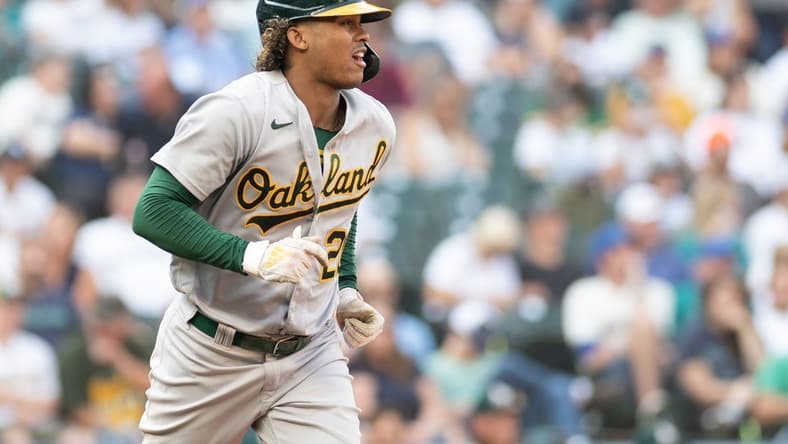 Oct 2, 2022; Seattle, Washington, USA; Oakland Athletics center fielder Cristian Pache (20) runs towards first base after walking against the Seattle Mariners during the eighth inning at T-Mobile Park. Mandatory Credit: Steven Bisig-USA TODAY Sports