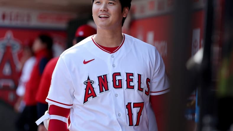 Oct 2, 2022; Anaheim, California, USA; Los Angeles Angels designated hitter Shohei Ohtani (17) smiles in the dugout before the game against the Texas Rangers at Angel Stadium. Mandatory Credit: Kiyoshi Mio-USA TODAY Sports