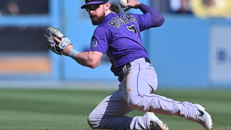 Oct 2, 2022; Los Angeles, California, USA; Colorado Rockies second baseman Brendan Rodgers (7) makes a play to throw out Los Angeles Dodgers first baseman Freddie Freeman (5) at second base in the sixth inning at Dodger Stadium. Mandatory Credit: Jayne Kamin-Oncea-USA TODAY Sports