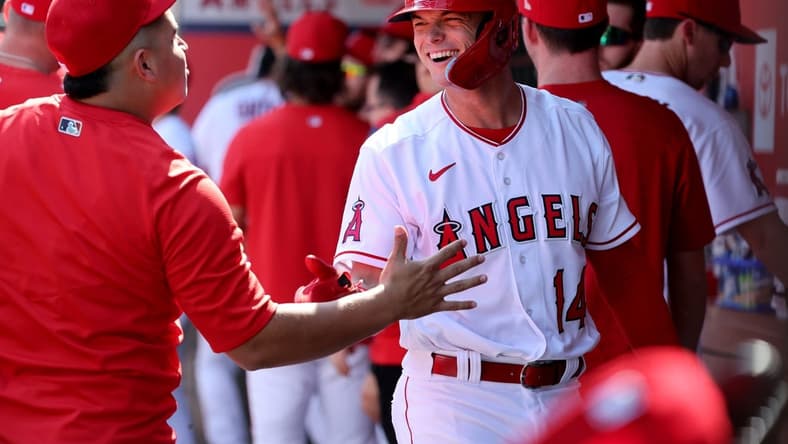 Oct 2, 2022; Anaheim, California, USA; Los Angeles Angels catcher Logan O'Hoppe (14) is greeted in the dugout after scoring a run during the first inning at Angel Stadium. Mandatory Credit: Kiyoshi Mio-USA TODAY Sports