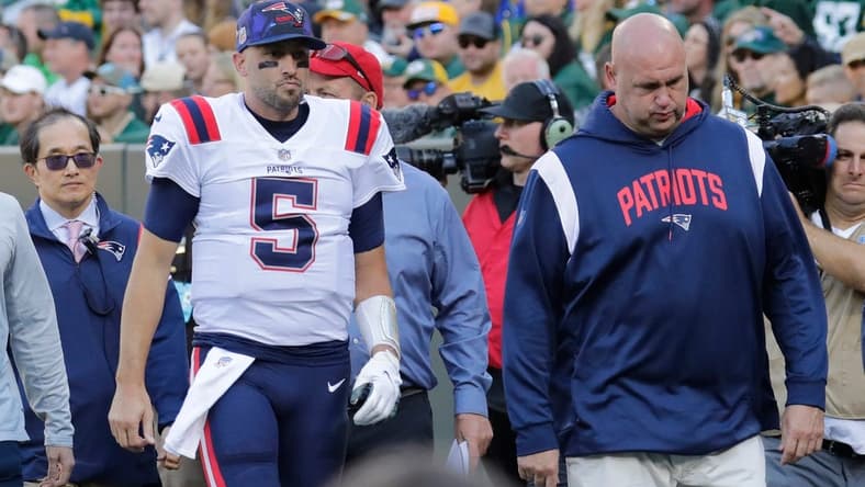 New England Patriots quarterback Brian Hoyer (5) leaves the field in the second quarter against the Green Bay Packers on Sunday, Oct. 2, at Lambeau Field in Green Bay, Wisconsin. He was being evaluated for a head injury.

Mjs Apc Packvspatriots 1002220574djp