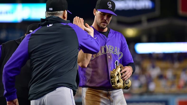 October 3, 2022; Los Angeles, California, USA; Colorado Rockies manager Bud Black (10) and left fielder Sean Bouchard (12) celebrate the victory against the Los Angeles Dodgers at Dodger Stadium. Mandatory Credit: Gary A. Vasquez-USA TODAY Sports