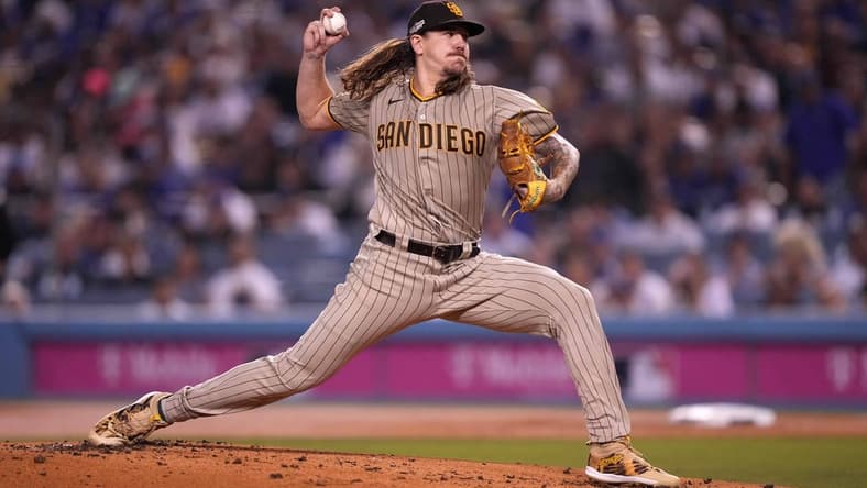 Oct 11, 2022; Los Angeles, California, USA; San Diego Padres pitcher Mike Clevinger (52) throws in the first inning of game one of the NLDS for the 2022 MLB Playoffs against the Los Angeles Dodgers at Dodger Stadium. Mandatory Credit: Kirby Lee-USA TODAY Sports
