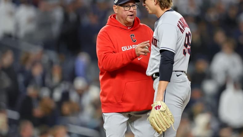 Oct 18, 2022; Bronx, New York, USA; Cleveland Guardians manager Terry Francona (77) takes relief pitcher James Karinchak (99) out of the game against the New York Yankees during the seventh inning in game five of the ALDS for the 2022 MLB Playoffs at Yankee Stadium. Mandatory Credit: Brad Penner-USA TODAY Sports
