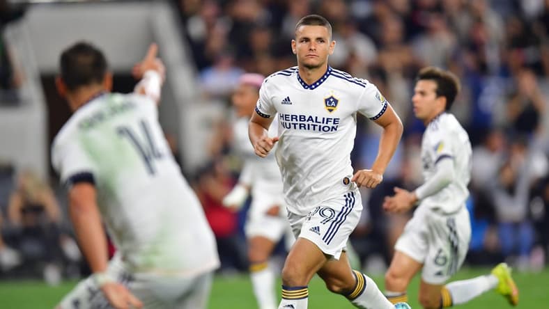 Oct 20, 2022; Los Angeles, California, US; Los Angeles Galaxy forward Dejan Joveljic (99) reacts after scoring a goal during the second half of the MLS Cup Playoff semifinal against the Los Angeles FC at Banc Of California Stadium. Mandatory Credit: Gary A. Vasquez-USA TODAY Sports