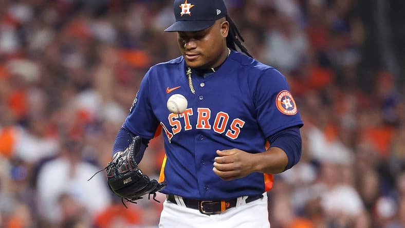 Nov 5, 2022; Houston, Texas, USA; Houston Astros starting pitcher Framber Valdez (59) flips the ball out of his glove before pitching against the Philadelphia Phillies during the second inning in game six of the 2022 World Series at Minute Maid Park. Mandatory Credit: Troy Taormina-USA TODAY Sports