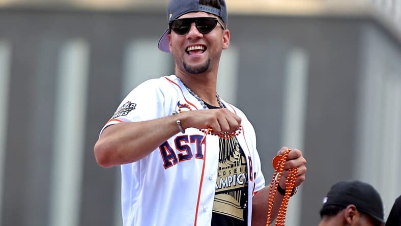 Nov 7, 2022; Houston, Texas, USA; Houston Astros first baseman Yuli Gurriel (10) throws beads to the crowd atop a parade vehicle during the Houston Astros Championship Parade in Houston, TX. Mandatory Credit: Erik Williams-USA TODAY Sports