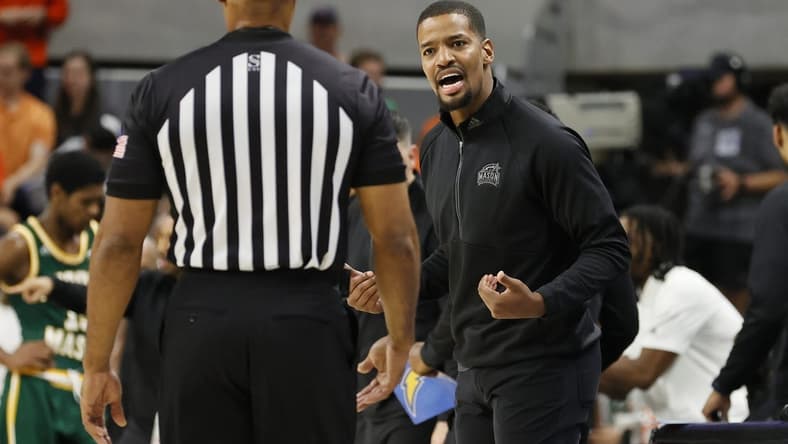 Nov 7, 2022; Auburn, Alabama, USA; George Mason Patriots head coach Kim English talks to an official during the first half against the Auburn Tigers at Neville Arena. Mandatory Credit: John Reed-USA TODAY Sports