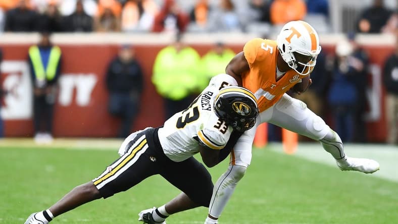 ***DUP***Tennessee quarterback Hendon Hooker (5)/Tennessee defensive back Kamal Hadden(5) is pulled down by Missouri linebacker Chad Bailey (33) during the NCAA college football game on Saturday, November 12, 2022 in Knoxville, Tenn.

Ut Vs Missouri