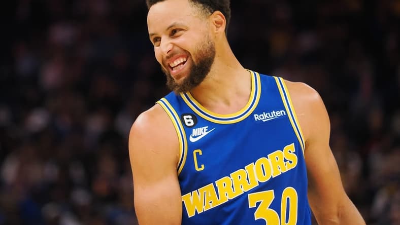 Nov 14, 2022; San Francisco, California, USA; Golden State Warriors point guard Stephen Curry (30) smiles between plays against the San Antonio Spurs during the second quarter at Chase Center. Mandatory Credit: Kelley L Cox-USA TODAY Sports