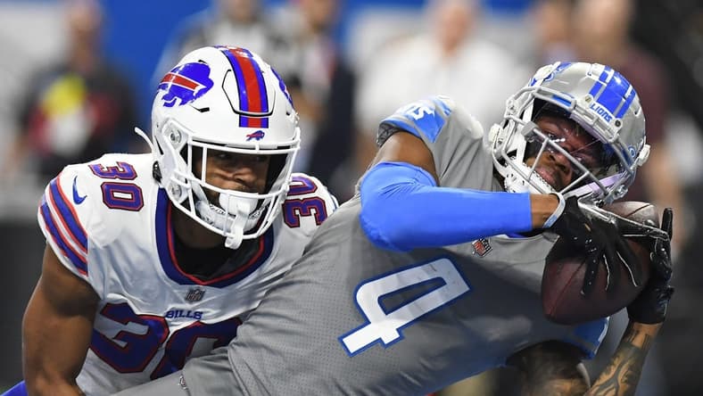 Nov 24, 2022; Detroit, Michigan, USA;  Detroit Lions wide receiver DJ Chark (4) catches a touchdown pass from quarterback Jared Goff (16) (not pictured) against the Buffalo Bills in the fourth quarter at Ford Field. Mandatory Credit: Lon Horwedel-USA TODAY Sports